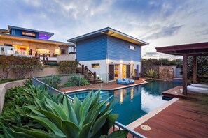 A modern house with a swimming pool, a covered patio, and a landscaped garden. - Fragrant Harbour with stunning ocean views (Gnarabup)
