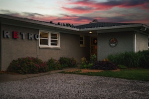 A building with a sign that reads 'RETRO' and a welcome sign with flowers. - 9 Properties on Entire Farm (Indianapolis)