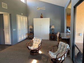 A room with two wicker chairs, a white wardrobe, and a ceiling fan. - Wailea Ekahi 21D top floor ocean view 1bedroom 2bath short level walk to beach! (Kihei)
