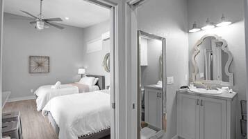 Cool sheets, a soft hum overhead, and nobody's alarm set. Sleep in.