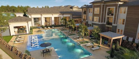 Un complejo residencial con piscina, sillas de descanso y un patio cubierto.