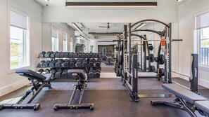 A gym with treadmills, weight machines, and dumbbells. - Landing | Modern 1BD in Whitestone (Fort Worth)