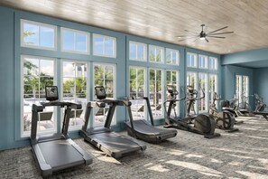 A gym with treadmills, stationary bikes, and exercise equipment. - Landing | Modern 2BD, Gym (Pensacola)