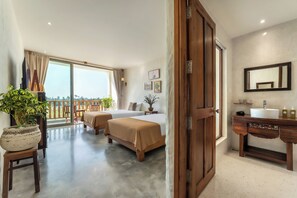A hotel room with two beds, a balcony with a view, a wooden dresser, and a bathroom with a sink and mirror. - Hidden 5BR Pool Villa - 8' Walk to An Bang Beach (Đà Nẵng)