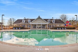A swimming pool with a no diving sign, a covered patio area, and a playground with a slide. - Landing | Beautiful 1BD, Clubhouse, Gym (Chattanooga)