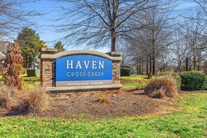 A sign for Haven Cross Creek with a website and phone number. - Landing | Modern 2BD, Clubhouse, Gym (Chattanooga)