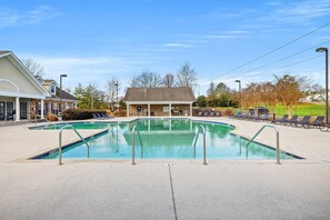 A swimming pool with a lounge area and a covered pavilion. - Landing | Modern 2BD, Clubhouse, Gym (Chattanooga)