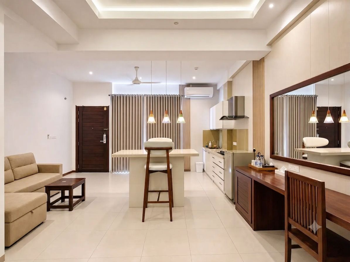 A modern living room with a sofa, a coffee table, and a bar area with a stool.