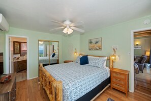 The primary king suite boasts a smart TV, an ensuite, & deck access​ - Lake View Cabin Game Room (Crestline)