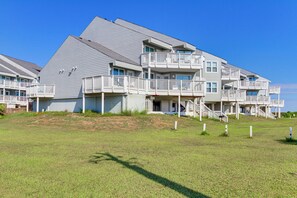 A multi-story residential building with balconies and a flat roof. - Poolside Days, Beach Strolls! Port Aransas Retreat (Port Aransas)