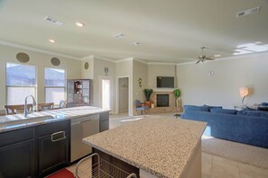 A modern kitchen with granite countertops, a built-in dishwasher, and a dining area with a table and chairs. - 9 Mi to Dtwn! Odessa Home w/ Private Yard (Odessa)