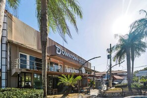 A commercial building with a sign reading 'Downtown Sosua.' - Central Sosua 1BR , Balcony , Hard Rock Perks (San Felipe de Puerto Plta)