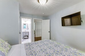 A bedroom with a bed, a wardrobe, and a mirror on the wall. - 3 Mi to Wadsworth Falls! Retreat w/ Backyard Oasis (Middletown)
