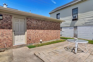 A two-story house with a brick facade and a white door. - Modern Galveston Retreat Near Beach, Strand & Pier (Galveston)