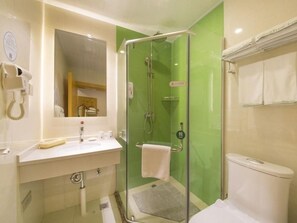 A bathroom with a glass-enclosed shower, a white sink, and a toilet. - Greentree Inn Beijing Tongzhou District Xuxinzhuang Subway Station Express Hotel (Tongzhou)