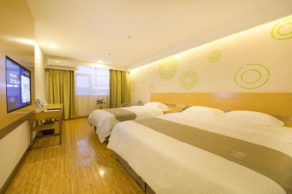 A hotel room with two beds, a desk with a television, and a window with curtains. - Greentree Inn Beijing Tongzhou District Xuxinzhuang Subway Station Express Hotel (Tongzhou)
