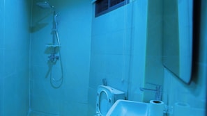 A bathroom with a shower, toilet, and sink. - Bluenix Haven Luxury Apartments  (Abuja Municipal)