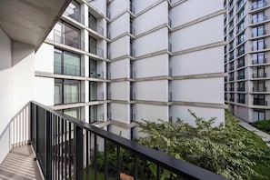A multi-story building with a modern architectural design, featuring balconies and large windows. - Warsaw | Krochmalna 61 | Modern Studio | Air Conditioning (Warszawa)