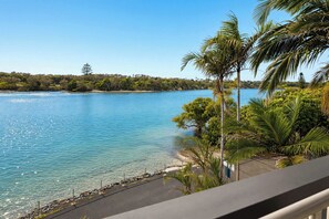 A clear view of a lake with a beach and a pathway leading to the water. - Marea by Khove - Kingscliff (Kingscliff)