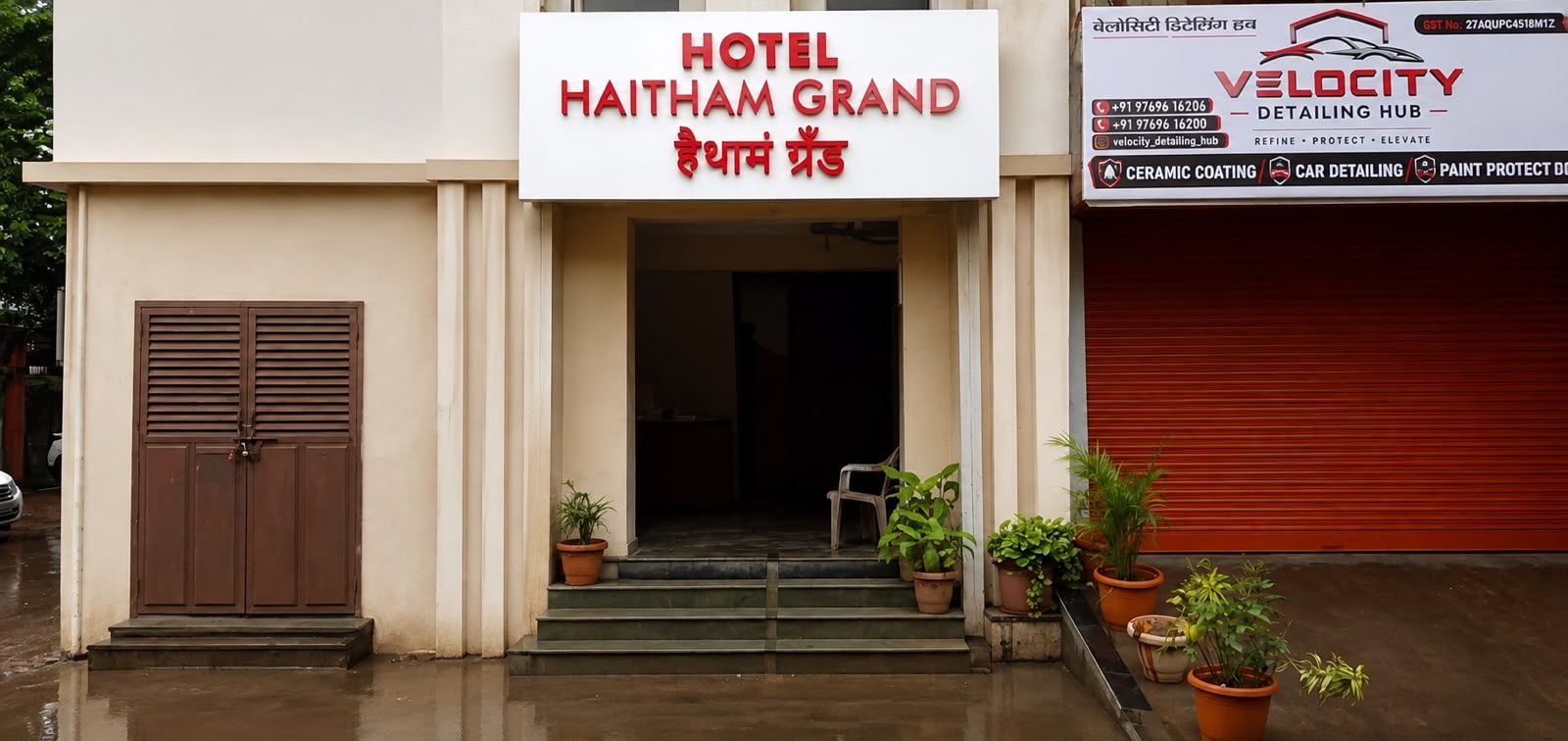 A hotel entrance with a sign reading 'HOTEL HAITHAM GRAND' and a nearby detailing hub named 'VELOCITY'.