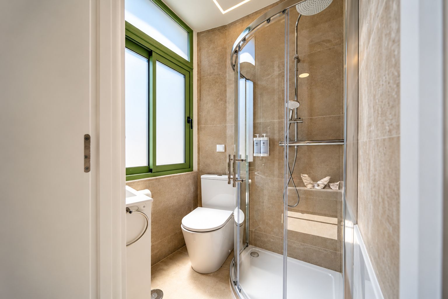 Bright modern bathroom with rainfall shower and stylish glass enclosure