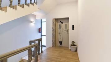 A staircase with wooden balusters leading to a landing.
