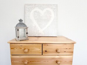 A wooden dresser with three drawers and a lantern on top. - The Family Holiday in Chester, Parking and Garden (Cheshire West and Chester)