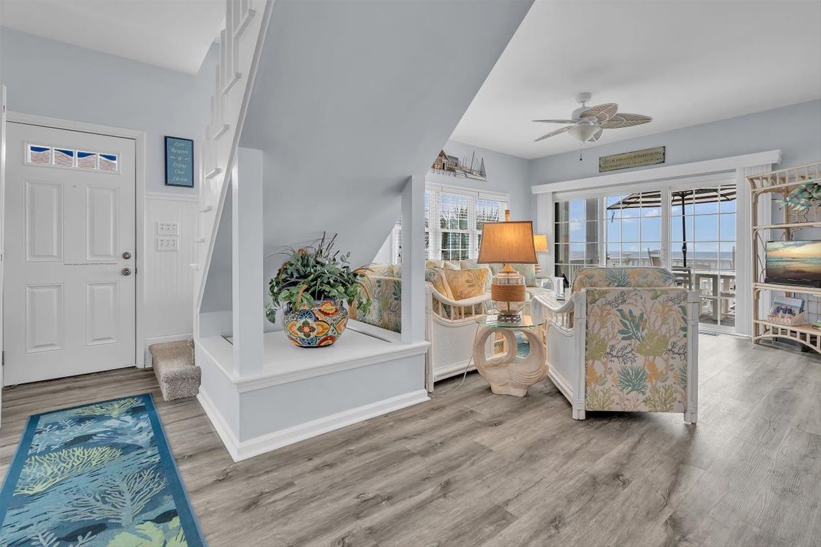 Step into your coastal retreat, where soft blues and coastal-inspired decor welcome you home. Through those bright windows, the ocean stretches before you, promising peaceful mornings and unforgettable sunsets.