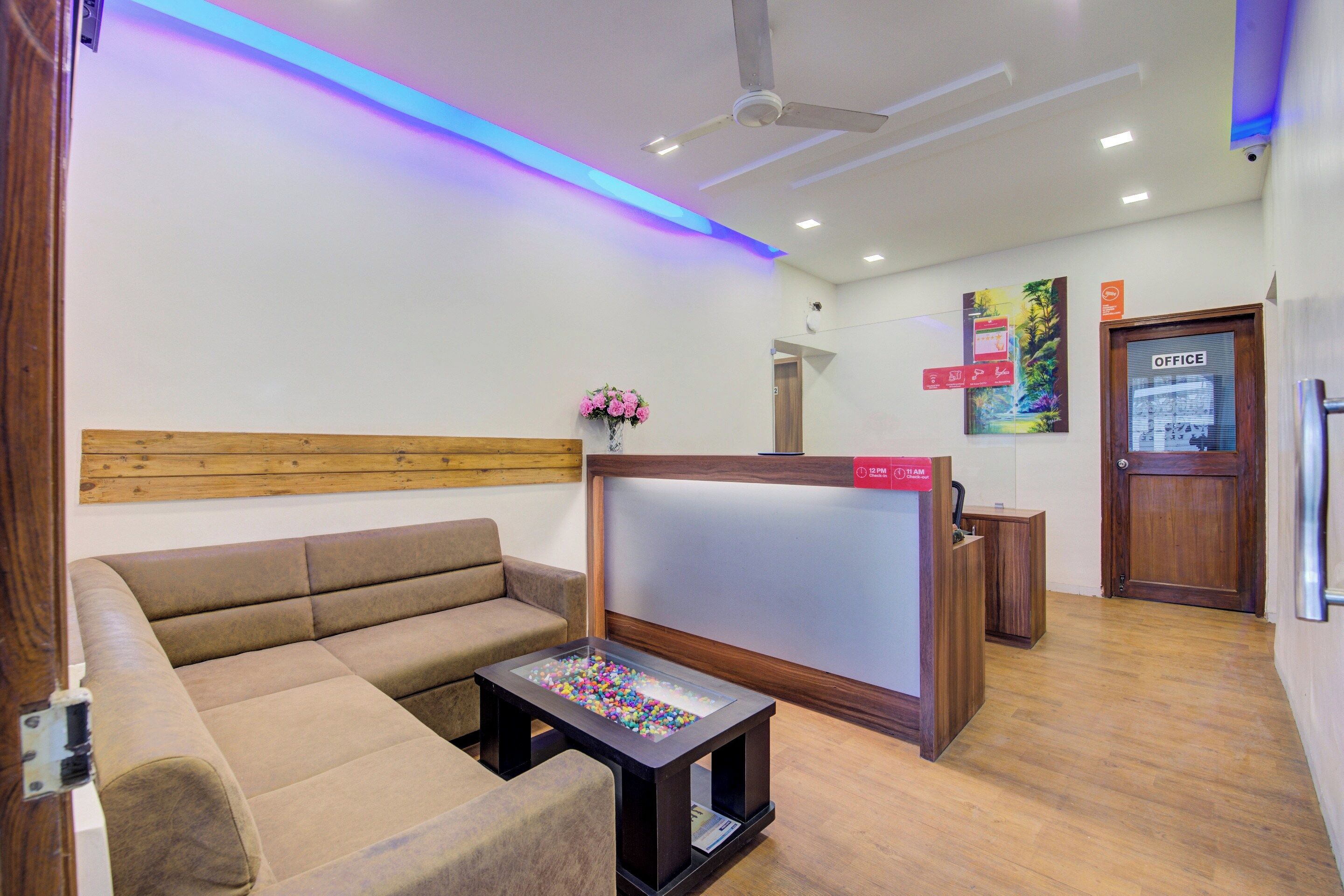 A modern living room with a sofa, a coffee table, and a TV.
