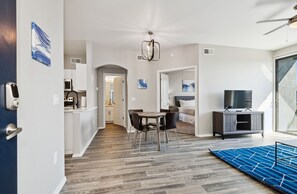 A modern interior with a dining area, kitchen, and living space. - Ascent 1 Bed Gym Pool Cabanas 2 Miles to Mayo Clinic (Phoenix)