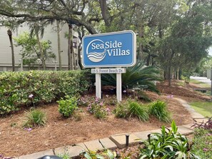 A sign for SeaSide Villas at 23 S. Forest Beach Dr. - Coastal Charm – Ocean Views & Island Breezes! (HILTON HEAD ISLAND)