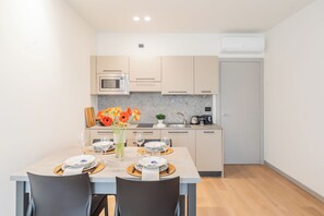 A modern kitchen with a dining area. - Close To Everything 3 by Rent All Como (Como)