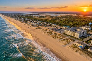 A coastal town with beachfront properties and a large hotel complex. - Luxury Beach Condo | Pool | Surf | Swim | Arcade (Virginia Beach)