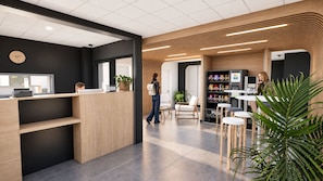 Een modern ingerichte receptie met een houten balie, een zithoek en een automaat.