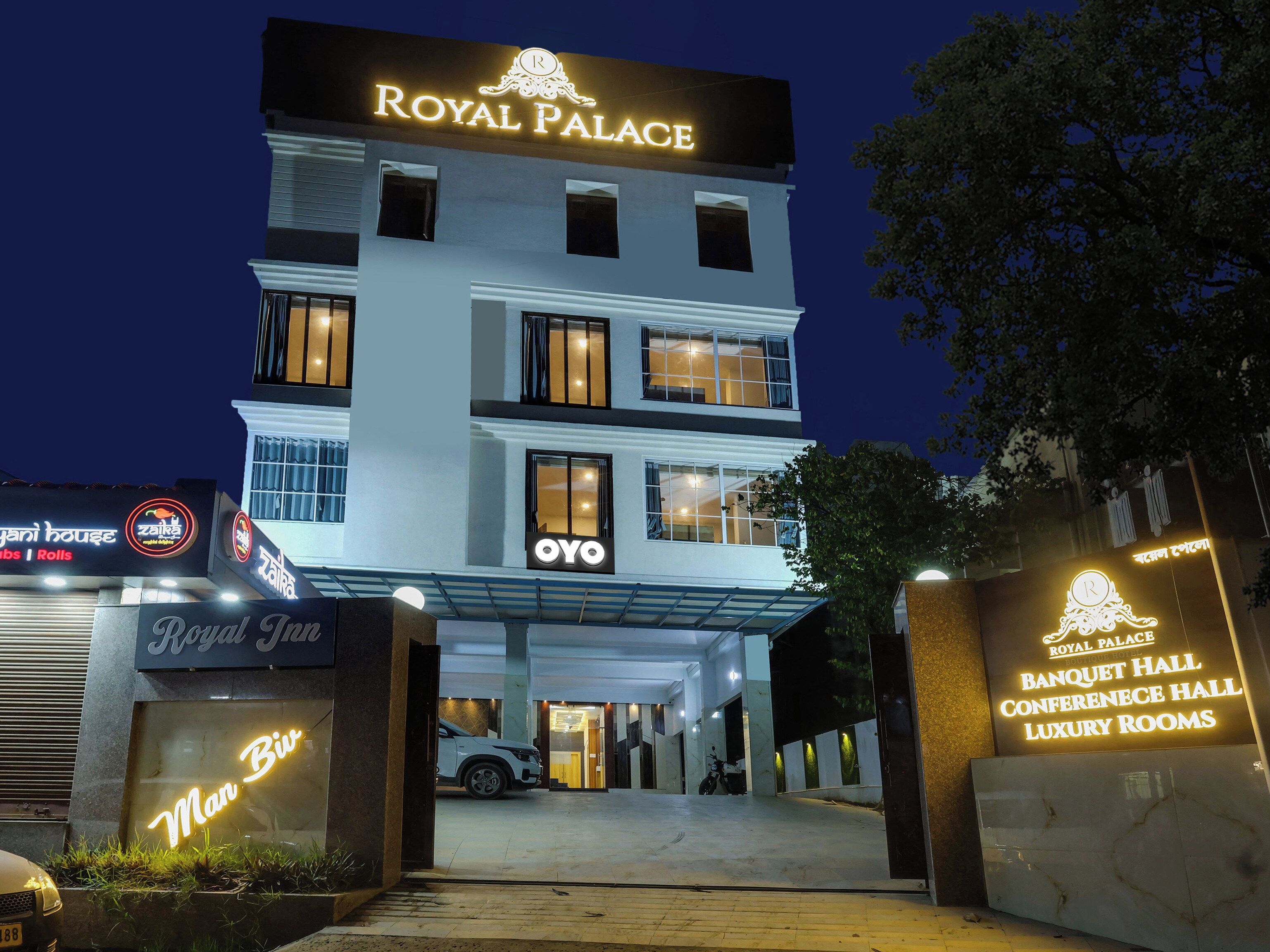 A multi-story building with a prominent 'Royal Palace' sign at the top.