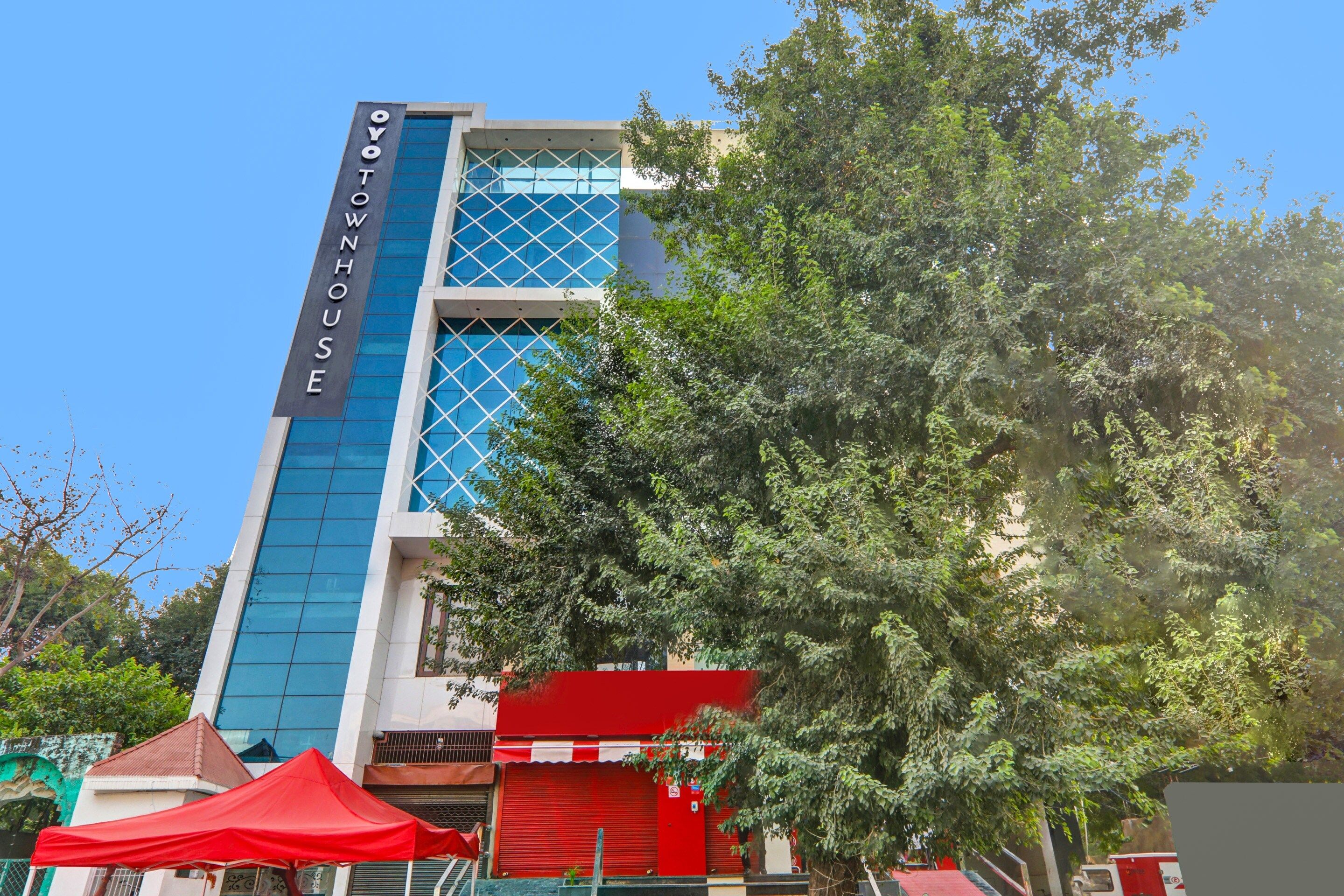 A modern building with a prominent sign reading 'YOYOW HOUSE'.