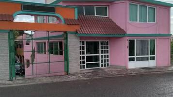 A two-story building with a sign that reads "HOTEL".