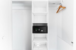 A white closet with a digital lock on the door. - Bright Spacious Studio Pininfarina Design (Hallandale Beach)