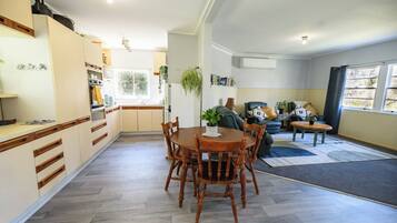 A compact living space with a kitchen, dining area, and seating area.