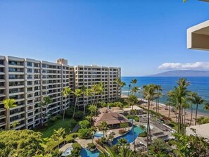 A hotel with multiple floors, a swimming pool, and a view of the ocean. - Kaanapali Alii - 4 BR (2 condos), Sleeps 12 (Lahaina)