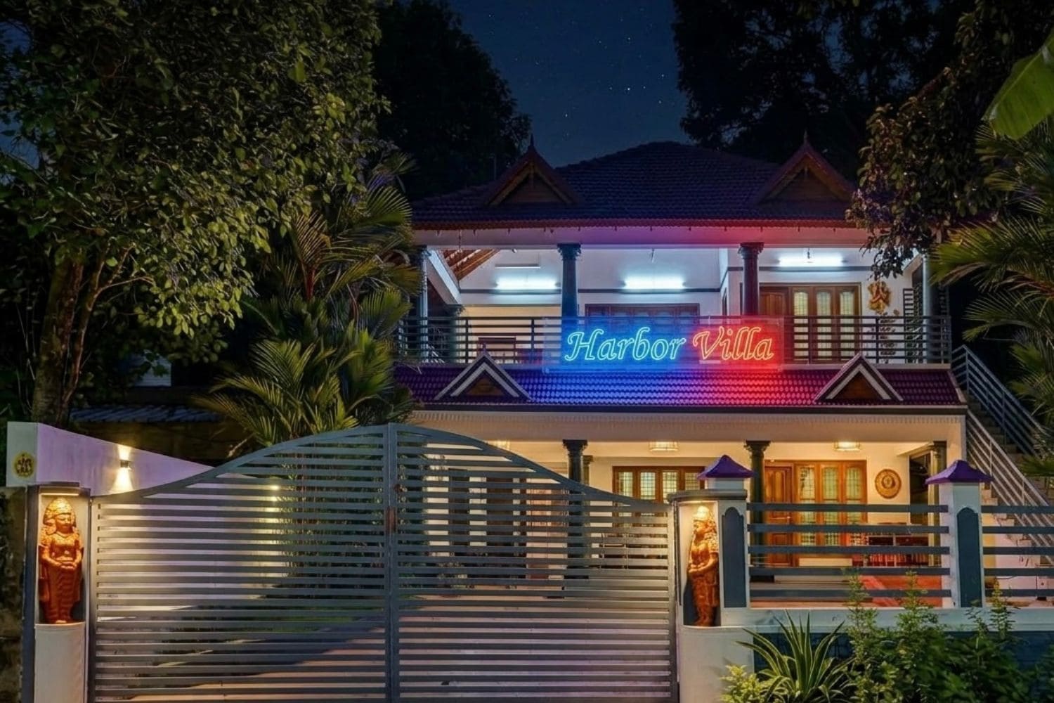 Un immeuble de deux étages, avec une enseigne au néon indiquant « Harbor Villa » à l’entrée.