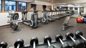 A gym with exercise equipment, including treadmills, elliptical machines, and free weights. - Pet Friendly Luxury Mammoth Westin Condo (Mammoth Lakes)