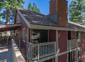 A two-story building with a balcony and a chimney. - Village Hidden Valley Family 1bd+Loft (Mammoth Lakes)