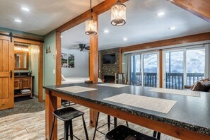 A spacious kitchen with a large island, wooden accents, and a view of the outdoors. - Hidden Valley Studio Walk to Village & Gondola (Mammoth Lakes)