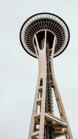 A tall tower with a large circular observation deck at the top. - Tacoma Seattle (Tacoma)