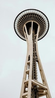 A tall tower with a large circular observation deck at the top.