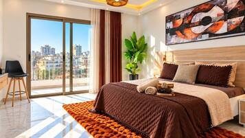 A modern bedroom with a large bed, a city view, and a large abstract painting.
