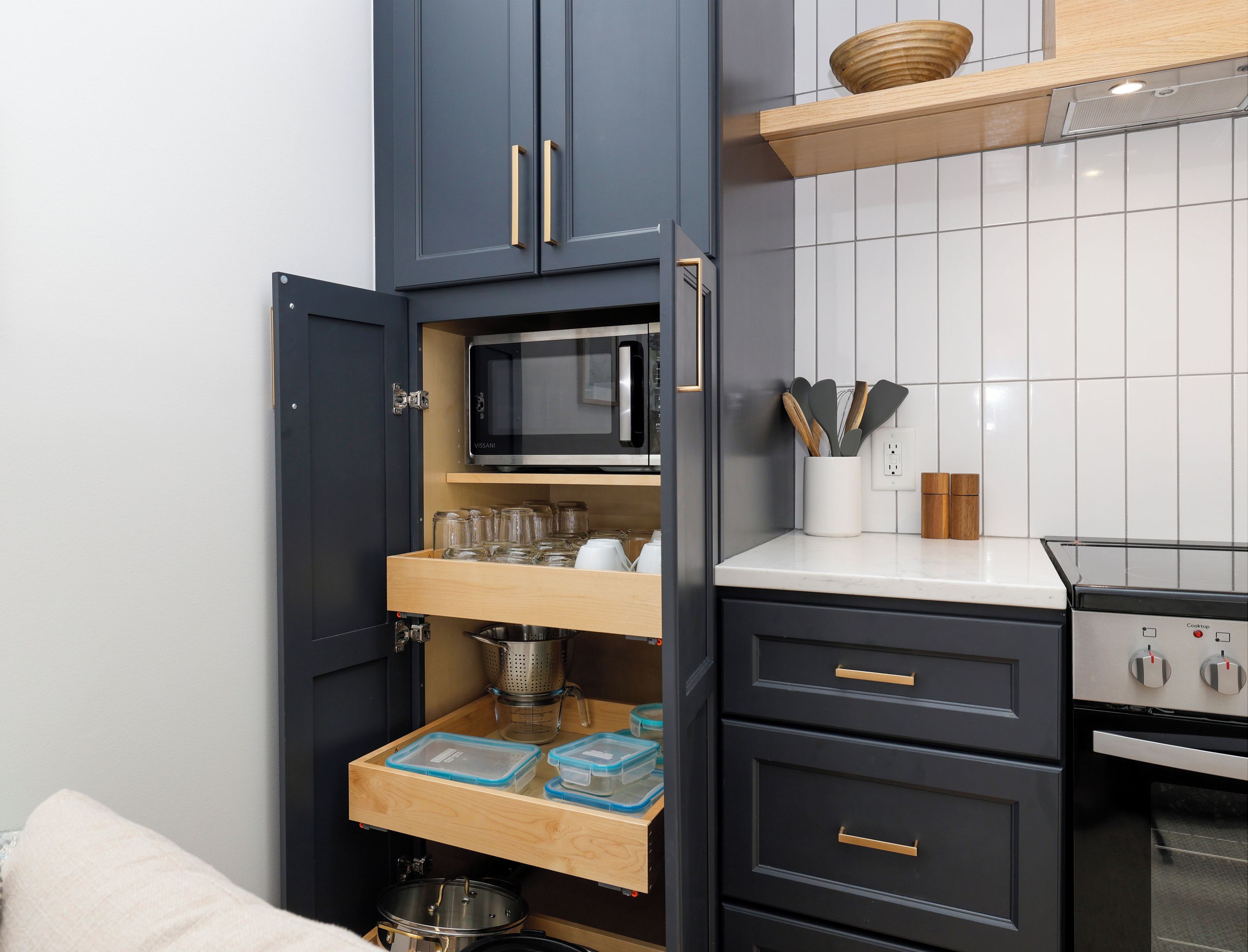 Microwave tucked inside of the cabinets