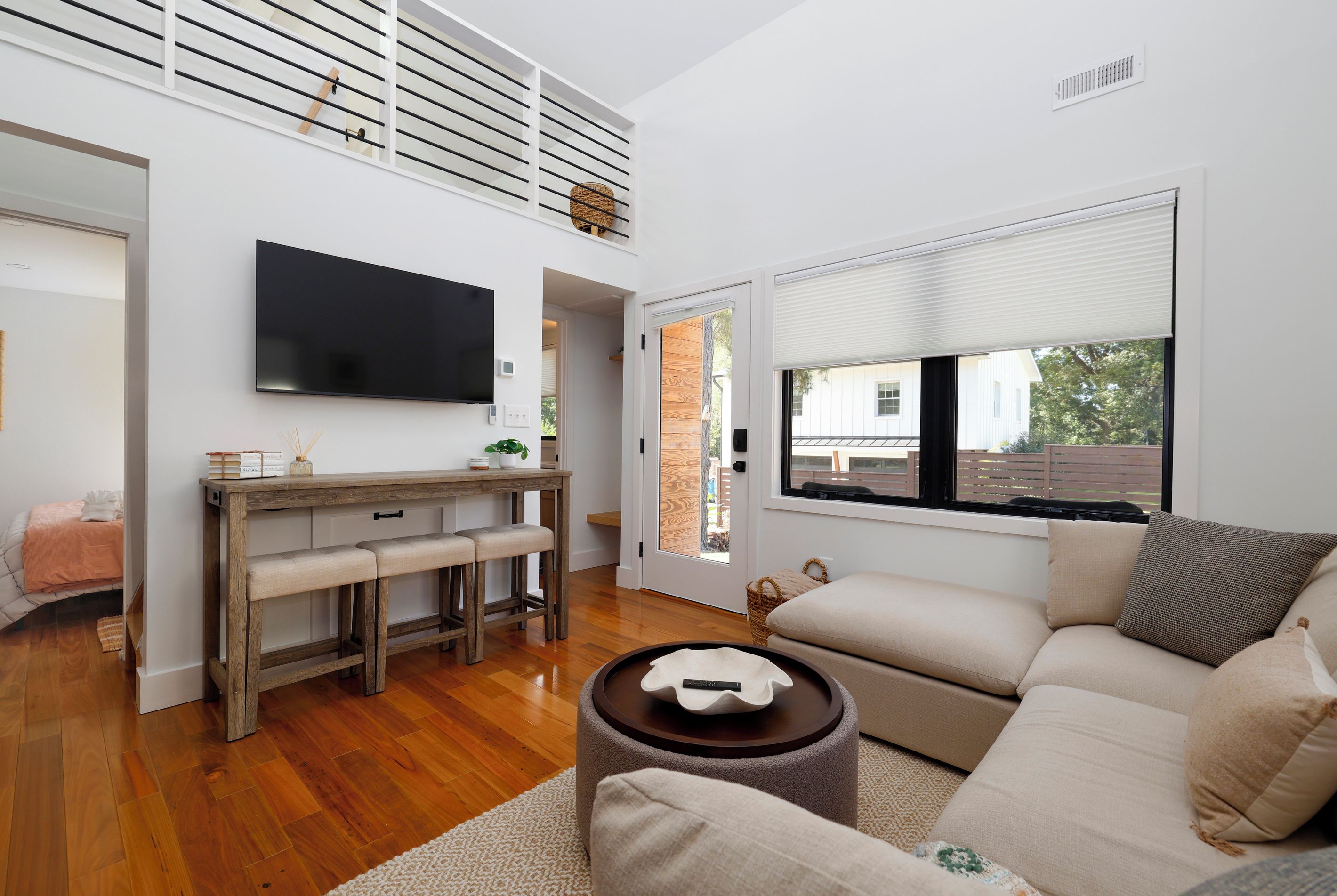 Open concept living space with a large sectional for max comfort and a smart tv