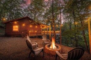 A rustic cabin with a deck, outdoor seating, and a fire pit. - Disconnect at Bearly Connected (Ellijay)